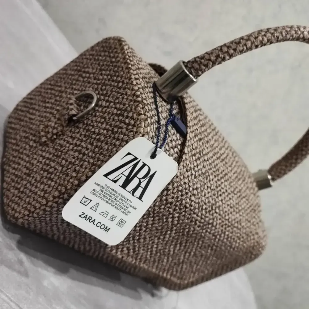 کیف ساندویچی چرم طرح کنف بند بلند نسکافه ای کرم سایز آزاد